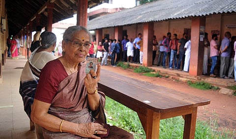A 75-year-old voter poses post casting her vote in Kerala. (Photo| A Sanesh/ EPS)