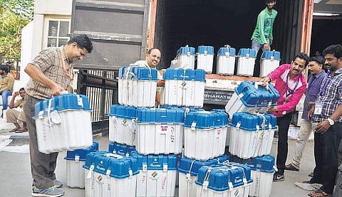 Election staff move EVMs which were used for polling. (Photo | EPS)