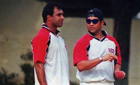Former Indian cricketers Robin Singh and Sachin Tendulkar during a practice session. (File Photo | EPS)