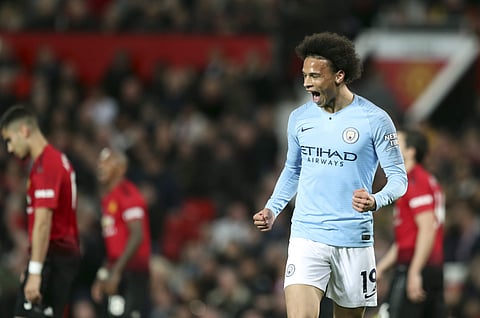Manchester City's Leroy Sane celebrates after scoring his side's second goal against Manchester United (Photo | AP)