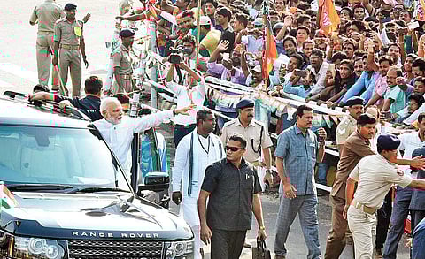 Prime Minister Narendra Modi waves to the crowd during his road show. (File Photo| Express)