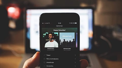 A Spotify user looks at the music streaming mobile app.
