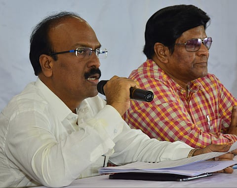 Secretary To Education Dr B Janardhan Reddy IAS presenting report on the three men committee(Photo | EPS)