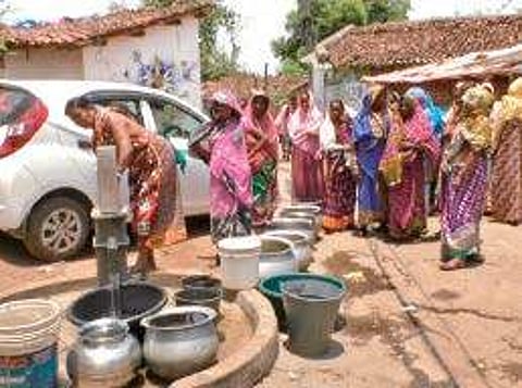 Women collecting water from a tubewell in Balangir | Express