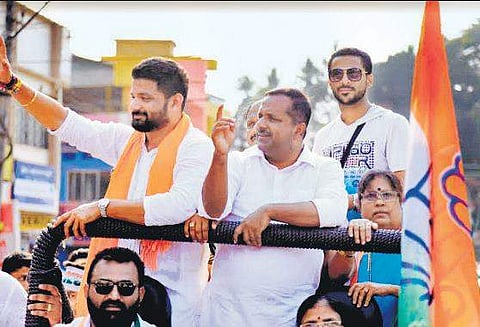 Dakshina Kannada Congress candidate Mithun Rai, accompanied by Minister U T Khader campaigned while sporting a saffron shawl recently