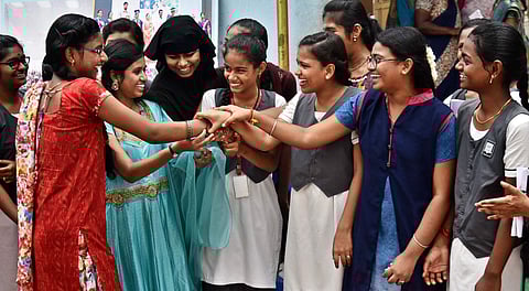 Students congratulate their clasmate Priyanka N S who secured 484 / 500 in 10th standered results at a private school on Monday in Chennai. (Express |P Jawahar P P)