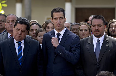 ewly-sworn-in National Assembly President Juan Guaidó, center, poses for a group photo with fellow lawmakers, in Caracas, Venezuela. (Photo | AP)