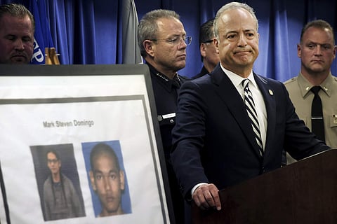 US Attorney Nick Hanna stands next to photos of Mark Steven Domingo, during a news conference in Los Angeles on Monday (Photo | AP)