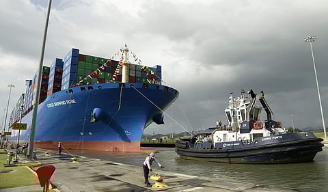 In this Dec. 3, 2018, photo, a Panama Canal worker docks the Chinese container ship Cosco at the Panama Canals' Cocoli Locks, in Panama City. (Photo | AP)
