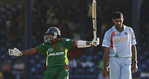 Bangladesh's Mushfiqur Rahim celebrates the victory over India as Munaf Patel looks on, during their group stage match at the Queen's Park Oval stadium in the Port of Spain (File Photo | AFP)