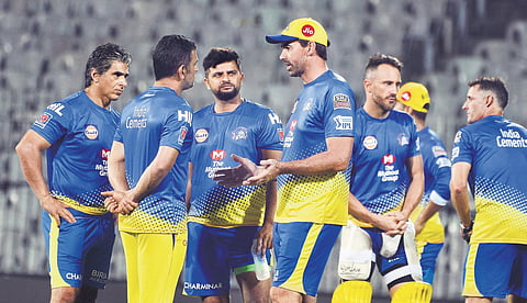 Chennai Super Kings skipper MS Dhoni (2nd L) and head coach Stephen Fleming (C) exchange a few words as Suresh Raina looks on in Chennai on Friday. (Photo | D Sampathkumar, EPS)