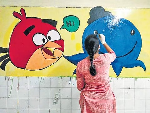 Around 20 students painted the paediatric ward