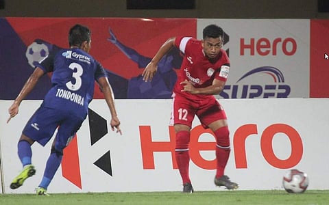 Chennaiyin FC's Tondonba Singh(L) battles for the ball with NorthEast United's player. (Photo | Twitter/@IndSuperLeague)