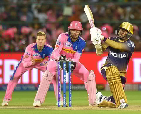 KKR's Sunil Narine plays a shot as RR's wicketkeeper Jos Buttler and Steve Smith look on. (Photo | PTI)