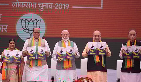Prime minister Narendra Modi, BJP President Amit Shah, Sushma Swaraj, Arun Jaitley and Rajnath Singh release the BJP Sankalp Patra at BJP headquarters in New Delhi on Monday. (Shekhar Yadav | EPS)