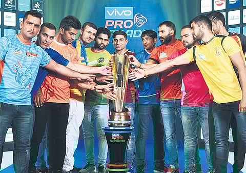 All 12 team captains pose with the PKL trophy in Hyderabad | R Satish Babu