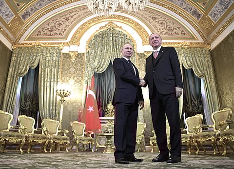 Russian President Vladimir Putin (L) and Turkish President Recep Tayyip Erdogan shake hands during their meeting in the Kremlin in Moscow (Photo | AP)
