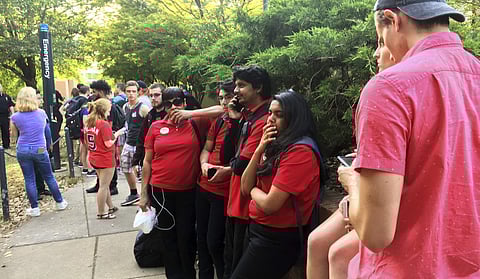 Students gather on the campus of the University of North Carolina Charlotte after a shooting Tuesday afternoon, April 30, 2019, in Charlotte, N.C. (Photo | AP)