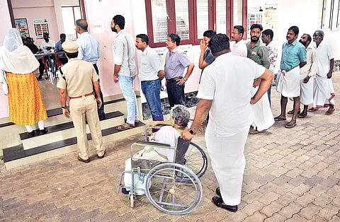 Voters queueing up at a booth in Kadungalloor on Tuesday | A Sanesh