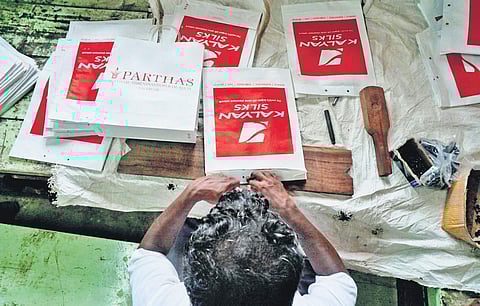 Jail inmate making a paper bag Nandakumar H V