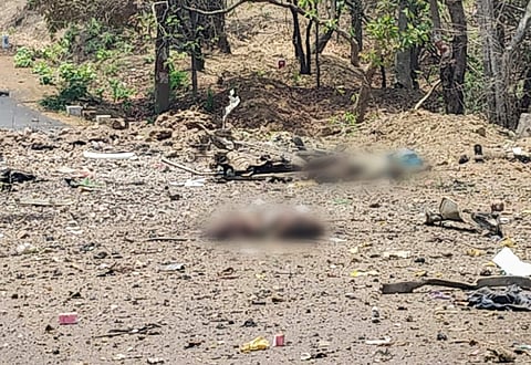 A view of the site where a police vehicle was blown up allegedly by Maoist rebels by using IED while it was carrying 16 security personnel in Gadchiroli district of Maharashtra Wednesday. (Photo | PTI)