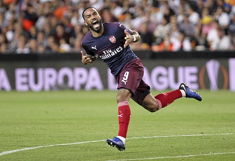 Alexandre Lacazette of Arsenal celebrating his goal against Valencia (Photo | AP)