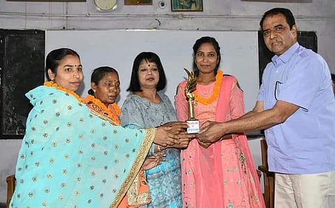 Sudha(in pink) is felicitated in her alma mater| EPS