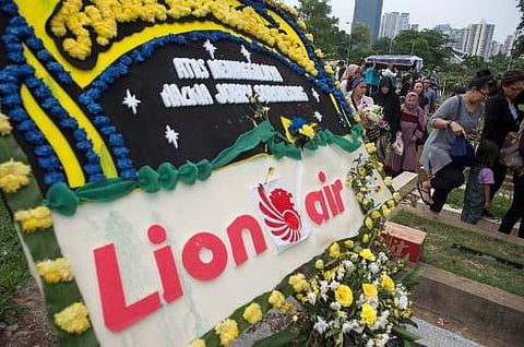 Family members and relatives carry the coffin of Hizkia Jorry Saroinsong, a victim of the ill-fated Lion Air flight JT 610, during his funeral in Jakarta on November 5, 2018, one week after the crash. (Photo | AFP)