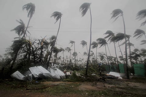 Damaged structures and trees are seen amid gusty winds of cyclone Fani. (Photo: AP)