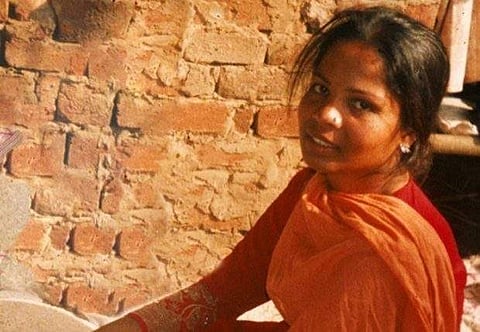 Aasia Bibi, a Pakistani Christian woman, listens to officials at a prison in Sheikhupura near Lahore, Pakistan. (Photo | Twitter)
