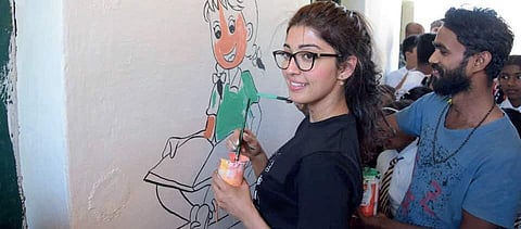 Actor Pranitha Subhash spruces up a Government Primary School in Balughatta in Chennarayapatna, Hassan, which she adopted recently (Photo| EPS)