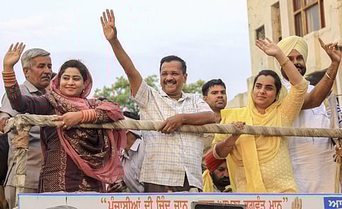 Delhi CM and AAP convenor Arvind Kejriwal with party's Bathinda seat candidate Baljinder Kaur and AAP MLA from Bathinda Rural Rupinder Kaur Ruby during an election roadshow for Lok Sabha polls in Bathinda. (Photo | PTI)