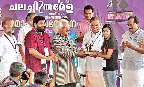 TNIE reporter Steni Simon receiving the media award for ‘Best Reporting’ in English Category at the International Children’s Film Festival of Kerala 2019, from filmmaker Adoor Gopalakrishnan during the ICFFK valedictory function in Thiruvananthapuram on T