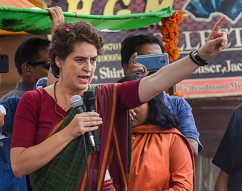 Congress General Secretary Priyanka Gandhi Vadra addresses the crowd during her election campaign roadshow in Mirzapur (Photo | PTI)
