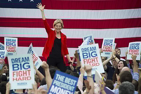 Democratic presidential candidate Sen. Elizabeth Warren, D-Mass., addresses a campaign rally at George Mason University in Fairfax, Va. Warren is gaining traction with black women debating which Democratic presidential candidate to back in a historically