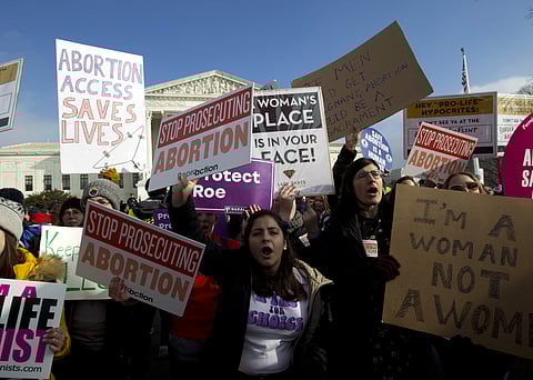 Abortion-rights activists protest outside of the U.S. Supreme Court, during the March for Life in Washington. (Photo | AP)