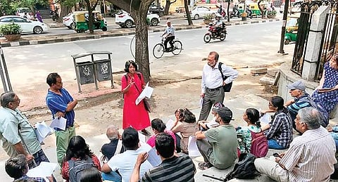 Volunteers of a social group conduct a social impact survey of the elevated corridor in KH Road, Bengaluru, on Saturday (Photo| EPS)
