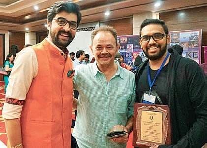 Adarsh receiving the award