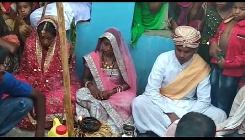 Anil Paikra sitting in the wedding mandap with his wife and lover Baghdol gram panchayat in Jashpur district of Chhattisgarh. (Photo | EPS)