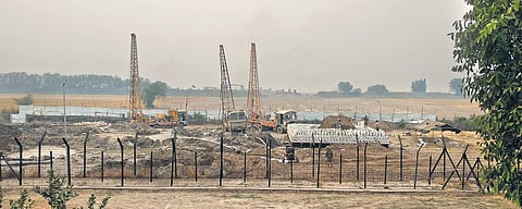 (Above) Men and machinery at work at the site of the Kartarpur Corridor; (below) ground being levelled for the project. | (Richa Sharma | EPS)