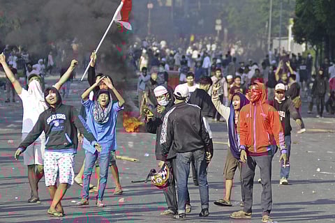Protesters clash with police during in Jakarta on May 22, 2019. (Photo | AP)