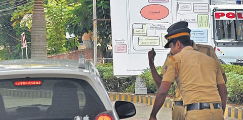 Policemen inspect a vehicle entering the counting station at Mar Ivanios Vidya Nagar in Thiruvananthapuram. With only a few hours to go for the results, security has been strengthened at the counting stations (Photo| B P Deepu/EPS)
