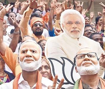 BJP supporters wearing Modi masks celebrate | Nagaraja Gadekal