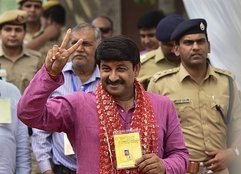 Delhi BJP chief Manoj Tiwari flashes victory sign in New Delhi after his win in the Lok Sabha elections on 23 May 2019. (Photo | PTI)