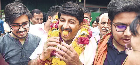 BJP's North-East Delhi nominee Manoj Tiwari celebrates his win. (Photo | Parveen Negi, EPS)