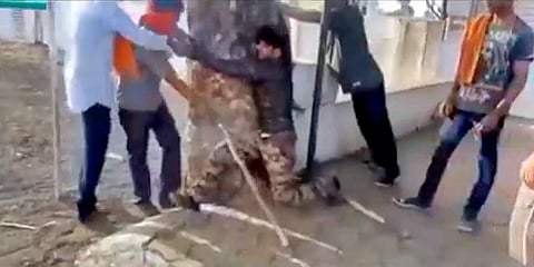 The Muslim men were tied to the tree and brutally thrashed. (Photo | Screengrab from the video)