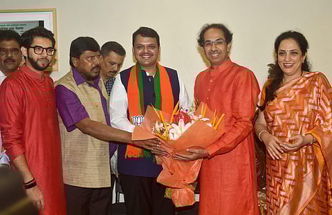 Maharashtra CM Devendra Fadnavis and Shiv Sena chief Uddhav Thackeray celebrate BJP and Shiv Sena alliance's win in Maharashtra. (File | PTI)