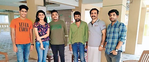 Priya (2nd from left) with director and team