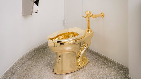 In this undated photo provided by the Solomon R. Guggenheim Museum, an18-karat gold toilet is shown in the museum's 14th floor restroom at the Solomon R. Guggenheim Museum in New York. | AP
