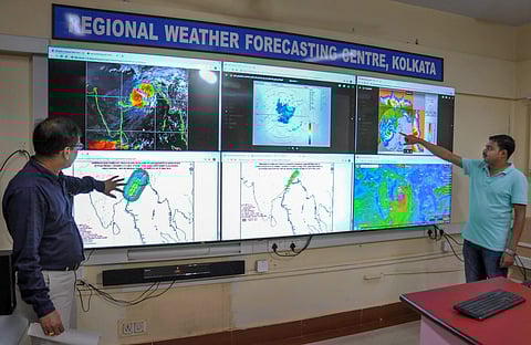 Officials monitor the progress of Cyclone 'Fani' at Regional Mertological Centre in Kolkata Friday. (Photo | PTI)